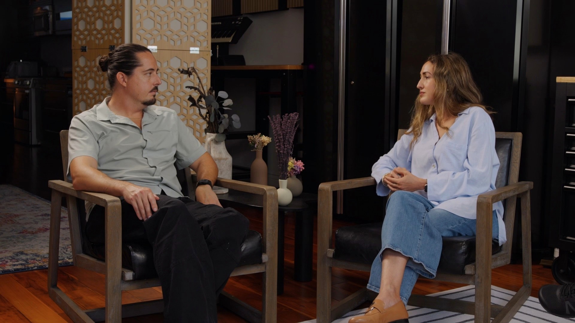 Alexis and Marie seated apart during a difficult conversation.
