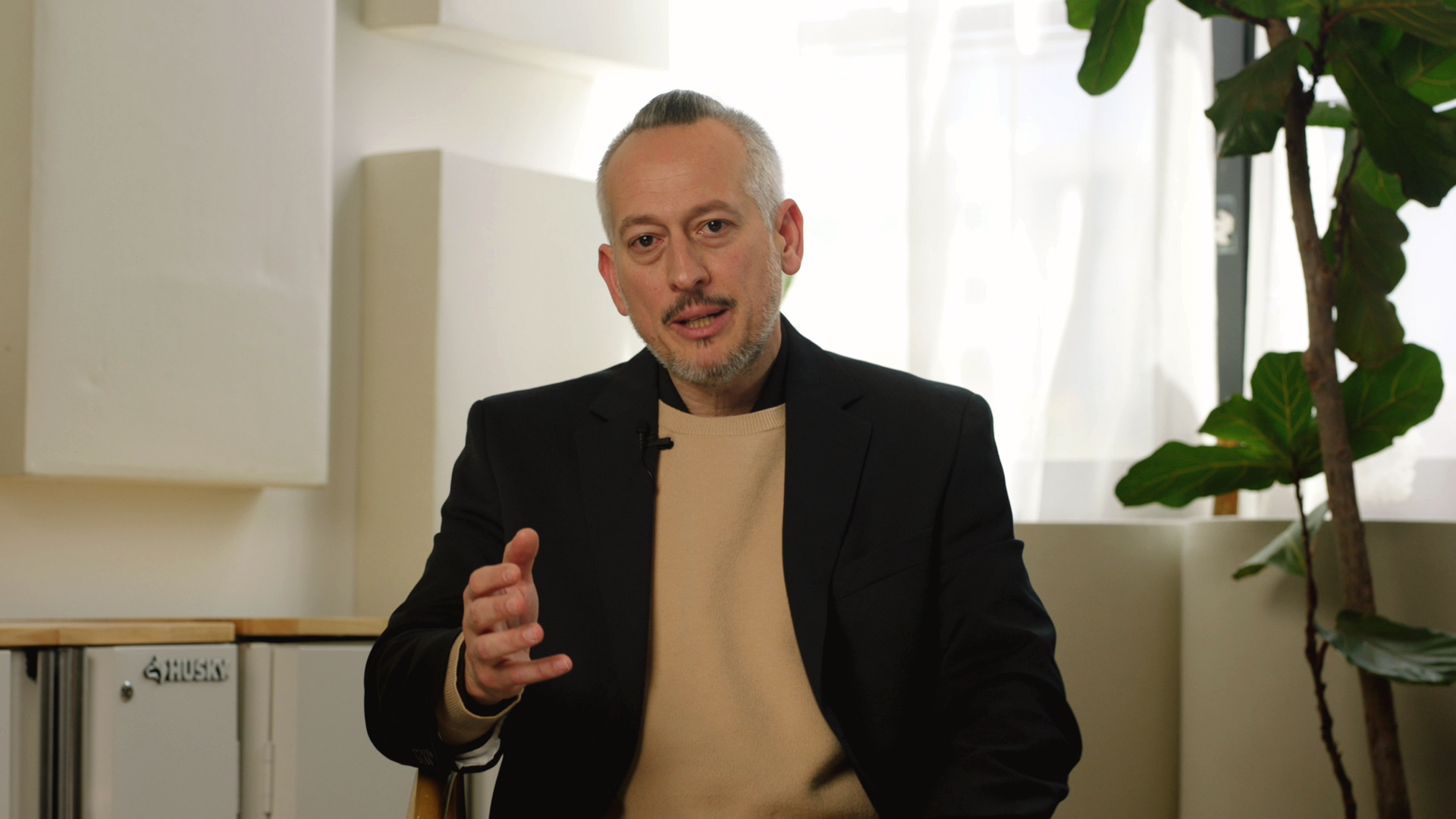 David Ibrahim speaking to camera.